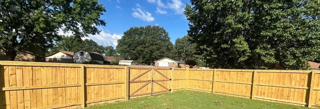Weathered gray fence before staining