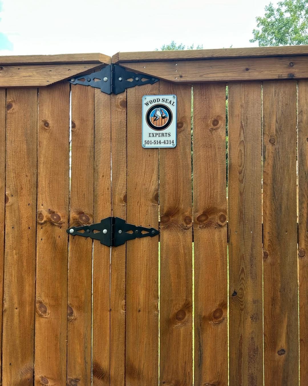 Privacy fence freshly stained a warm cedar tone
